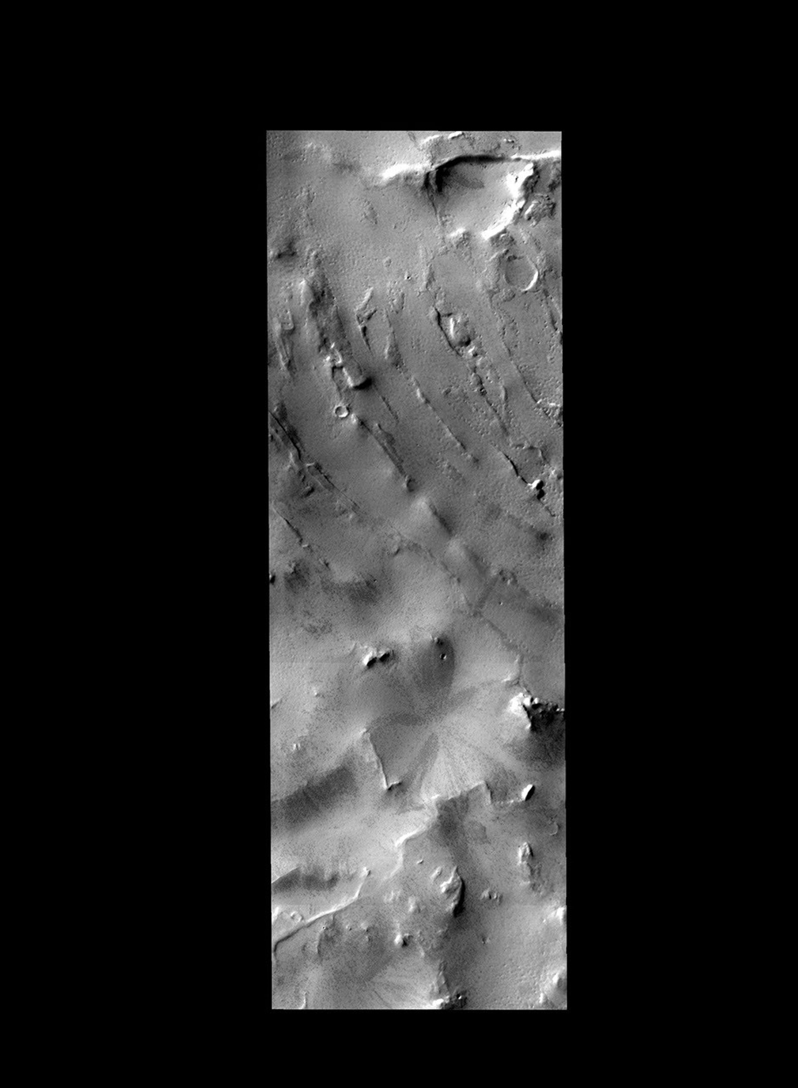 The curved ridges and hills in this image are located at high southern latitude. Ice and other polar actions have created this interesting surface on Mars as seen by NASA's Mars Odyssey spacecraft.
