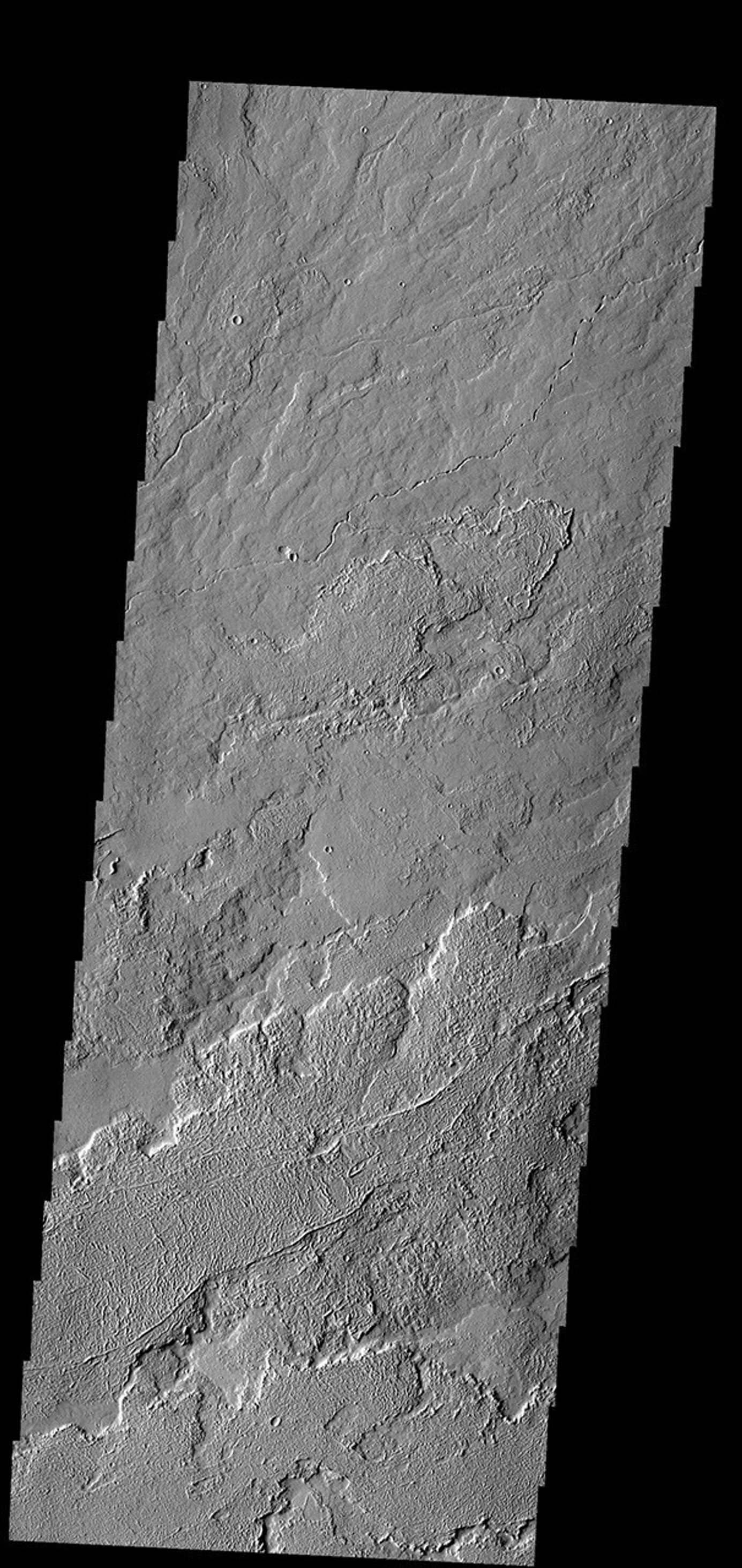 This image shows a small portion of the extensive Tharsis Volcanic Field. Several different surface textures are present on Mars as seen by NASA's Mars Odyssey spacecraft.