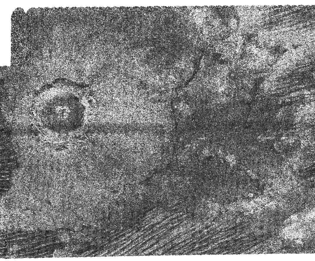 This image from NASA's Cassini radar instrument shows an impact crater with a diameter of 30 kilometers (19 miles) on the surface of Saturn's moon Titan.