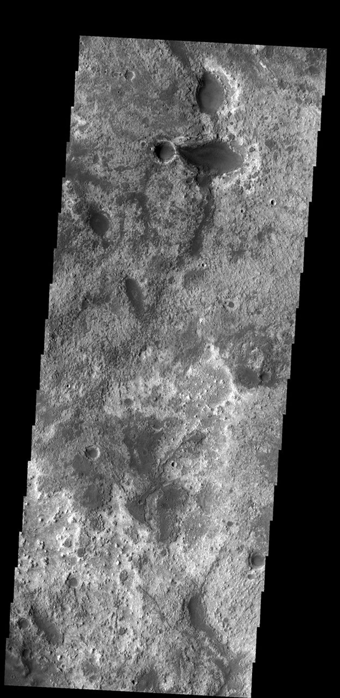 This region of Arabia Terra has several different layers of material exposed. These layers occur at the highland/lowland boundary on Mars as seen by NASA's Mars Odyssey spacecraft.