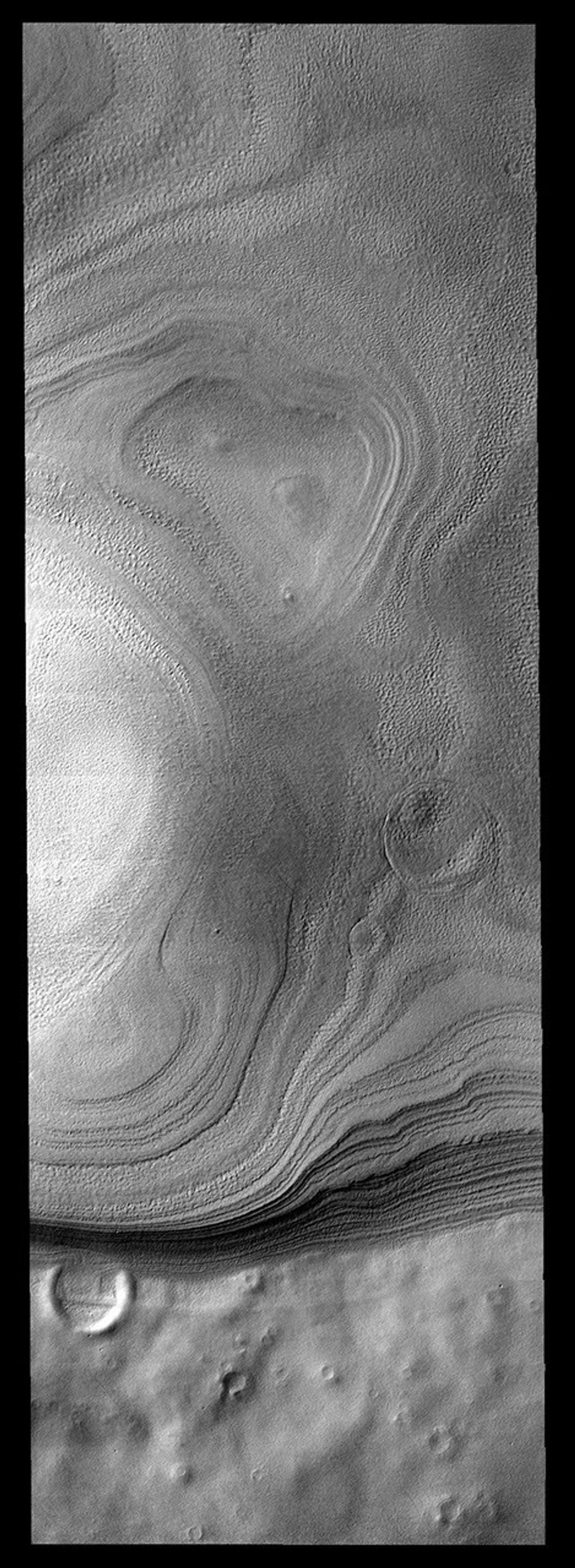Layers of ice are easily seen in this image of the margin of the South Polar cap on Mars as seen by NASA's Mars Odyssey spacecraft.