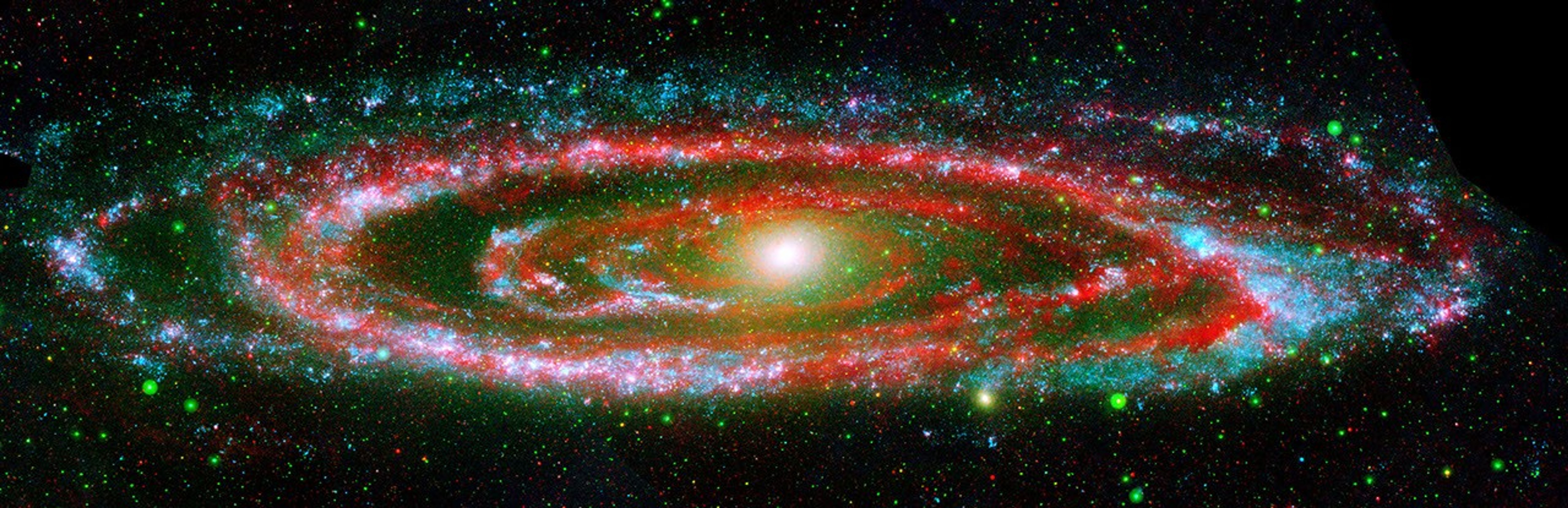 The many 'personalities' of our great galactic neighbor, the Andromeda galaxy, are exposed in this new composite image from NASA's Galaxy Evolution Explorer and Spitzer Space Telescope.