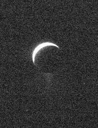A ghostly view of Saturn's moon Enceladus reveals the specter of the moon's icy plume of fine particles. Scientists continue to monitor the plume, where mission planning allows, using NASA's Cassini spacecraft's imaging cameras.