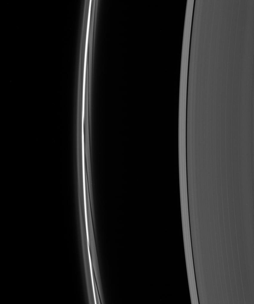 A close-up of the F ring shows dark gores in its interior faint ringlets following the passage of Prometheus. Each gore represents a single interaction of the moon with the F ring material as seen by NASA's Cassini spacecraft.