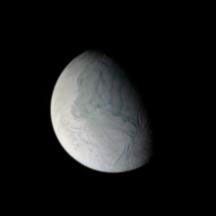 NASA's Cassini spacecraft looks down under at the tortured south polar region of Saturn's moon Enceladus, crossed by its 'tiger stripes,' or sulci, as the long, nearly parallel fractures are officially known.