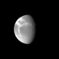 NASA's Cassini spacecraft spies bright fractures in the icy crust of Dione. This view looks toward the northern hemisphere on Dione's anti-Saturn side.