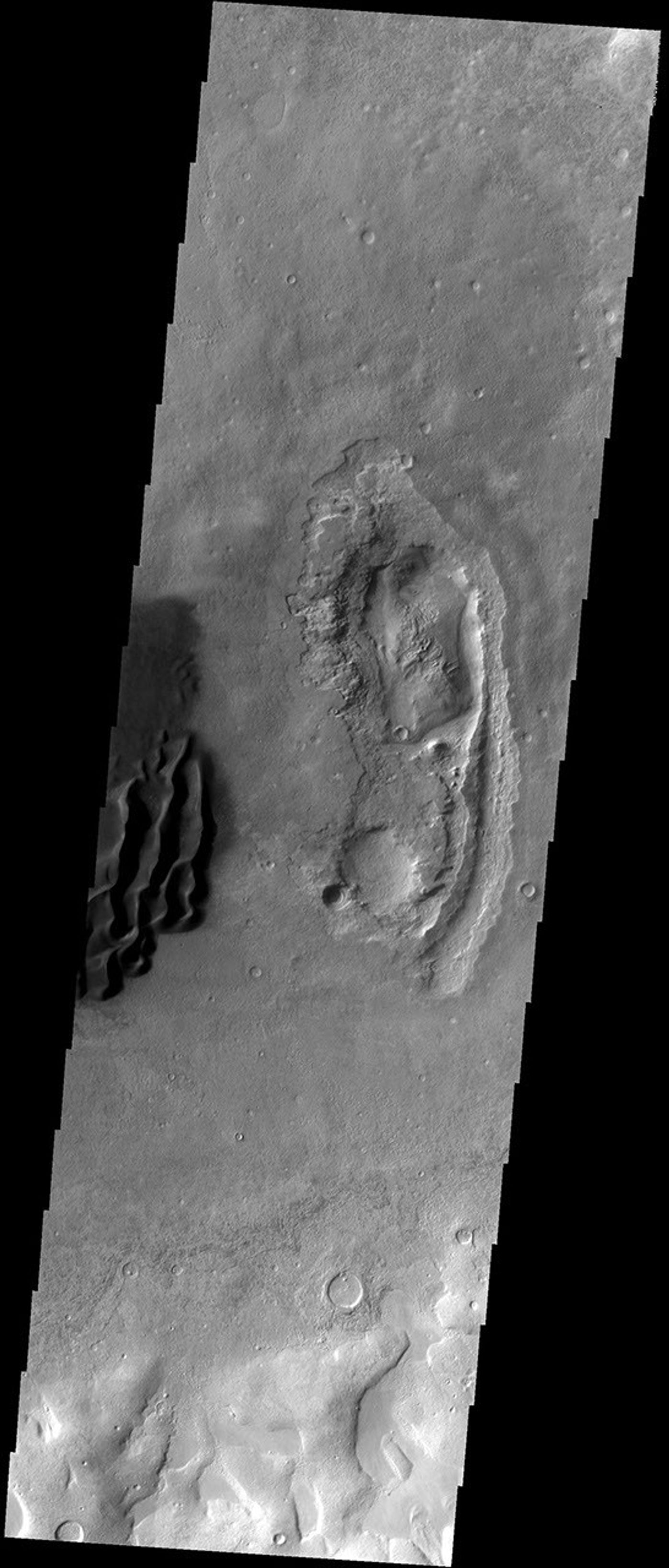 These dark sand dunes are located in an unnamed crater in Noachis Terra on Mars as seen by NASA's 2001 Mars Odyssey spacecraft.