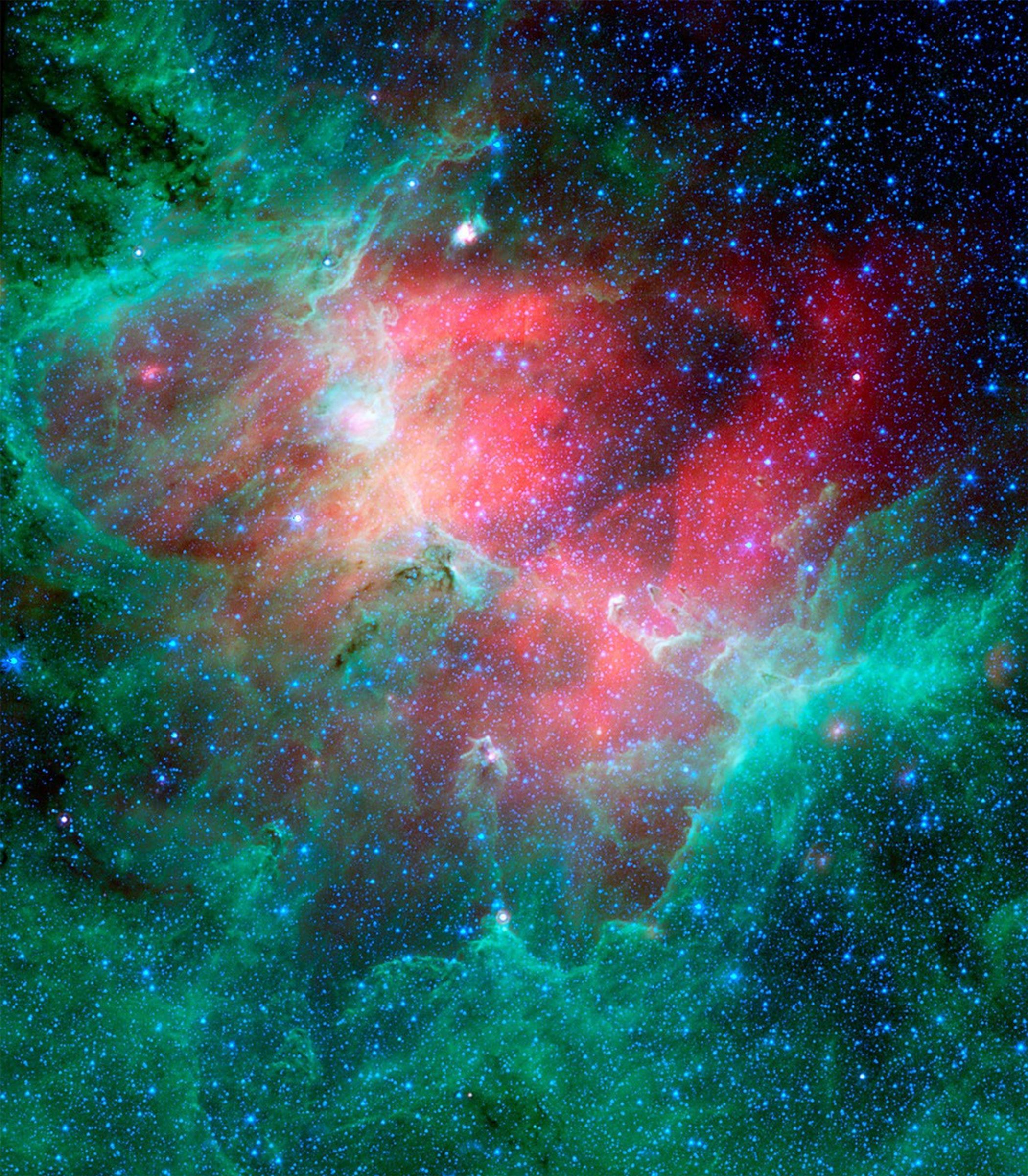 This majestic view taken by NASA's Spitzer Space Telescope tells an untold story of life and death in the Eagle nebula, an industrious star-making factory located 7,000 light-years away in the Serpens constellation.