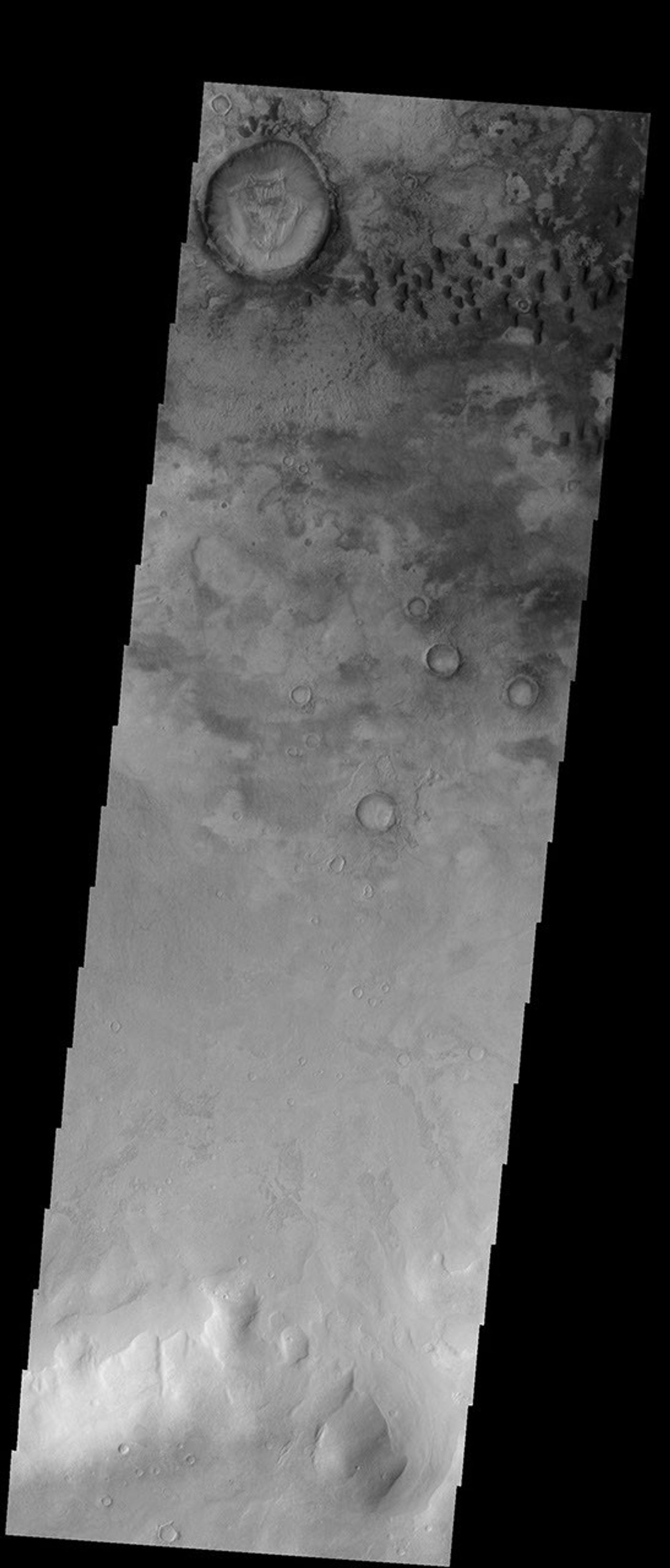 These sand dunes are located on the floor of Kaiser Crater on Mars as seen by NASA's Mars Odyssey spacecraft.