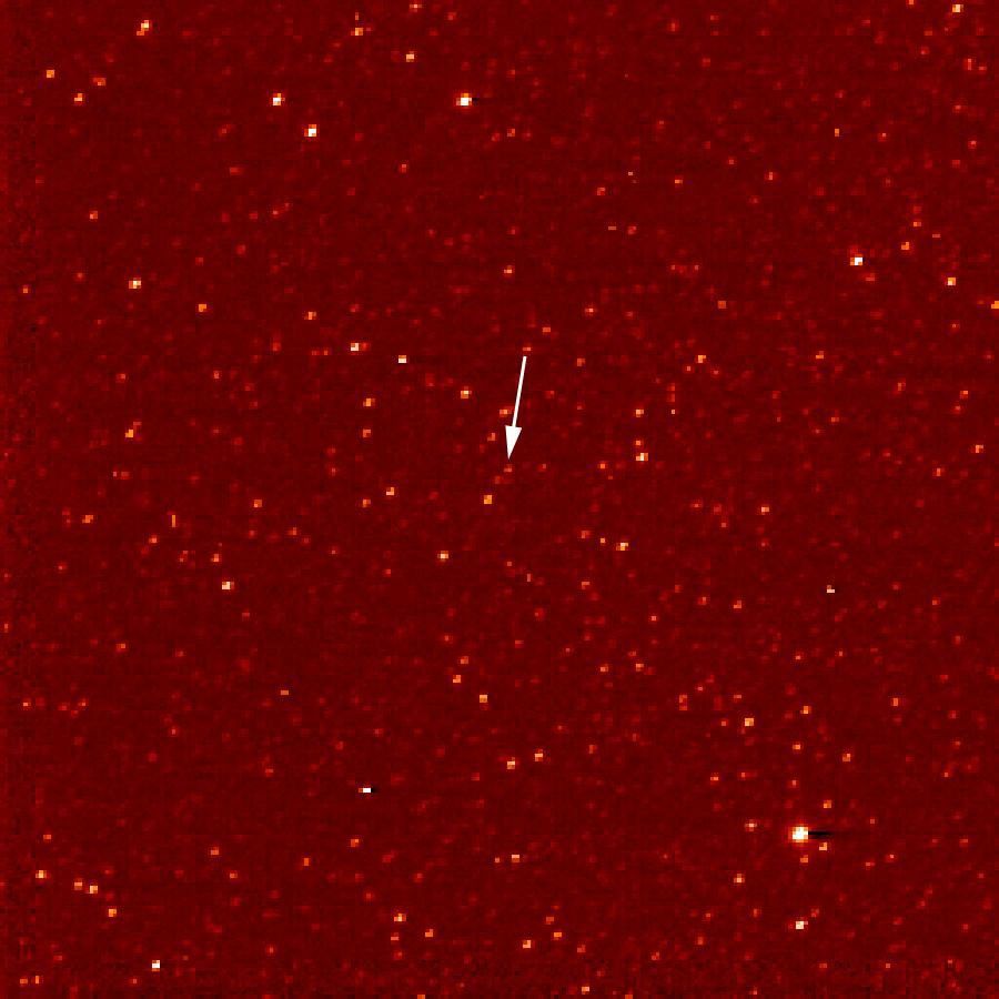 A white arrow marks Pluto in this NASA New Horizons Long Range Reconnaissance Imager picture taken Sept. 24, 2006. Pluto is little more than a faint point of light among a dense field of stars.