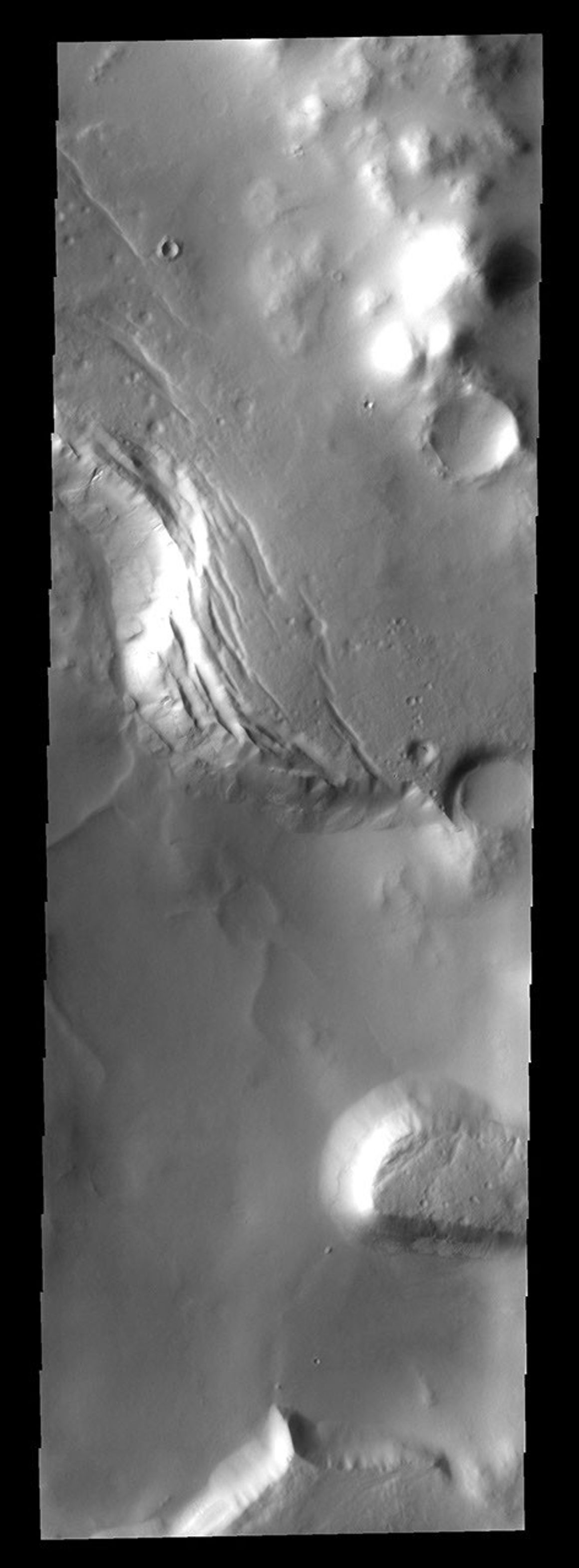 This image from NASA's Mars Odyssey spacecraft shows a portion of Lyell Crater. Lyell is one of the many craters in the souther hemisphere of Mars that has been filled with material after the formation of the crater.
