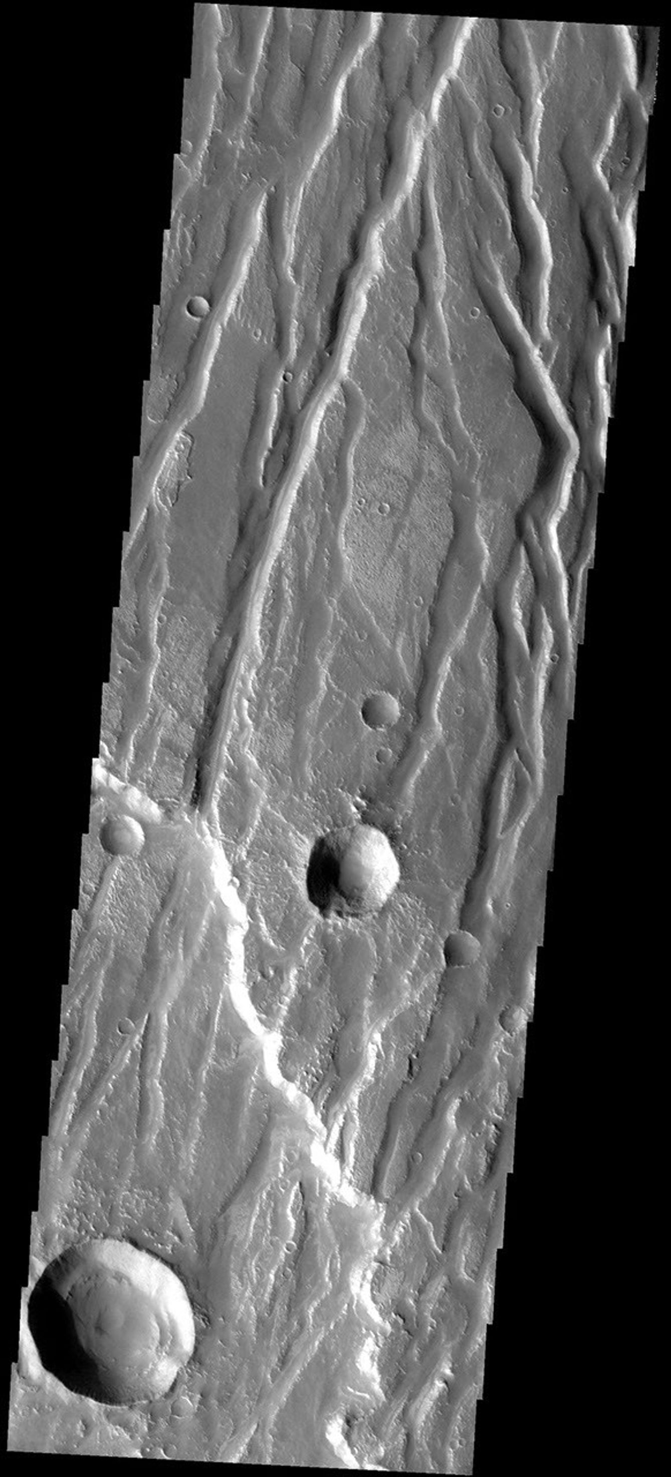This image from NASA's Mars Odyssey spacecraft shows fractures and graben in part of the highland called Claritas Rupes which extends southward from the western edge of Noctis Labyrinthus and divides the volcanic flows of Deadalia Planum and Solis Planum.