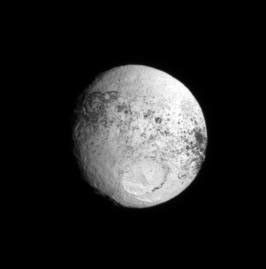 Following NASA's Cassini's highly successful flyby of Iapetus in Sept. 2007, the spacecraft repeatedly glanced back at the two-toned moon for some time. As Cassini receded from Iapetus, more and more of the bright trailing hemisphere rotated into view.