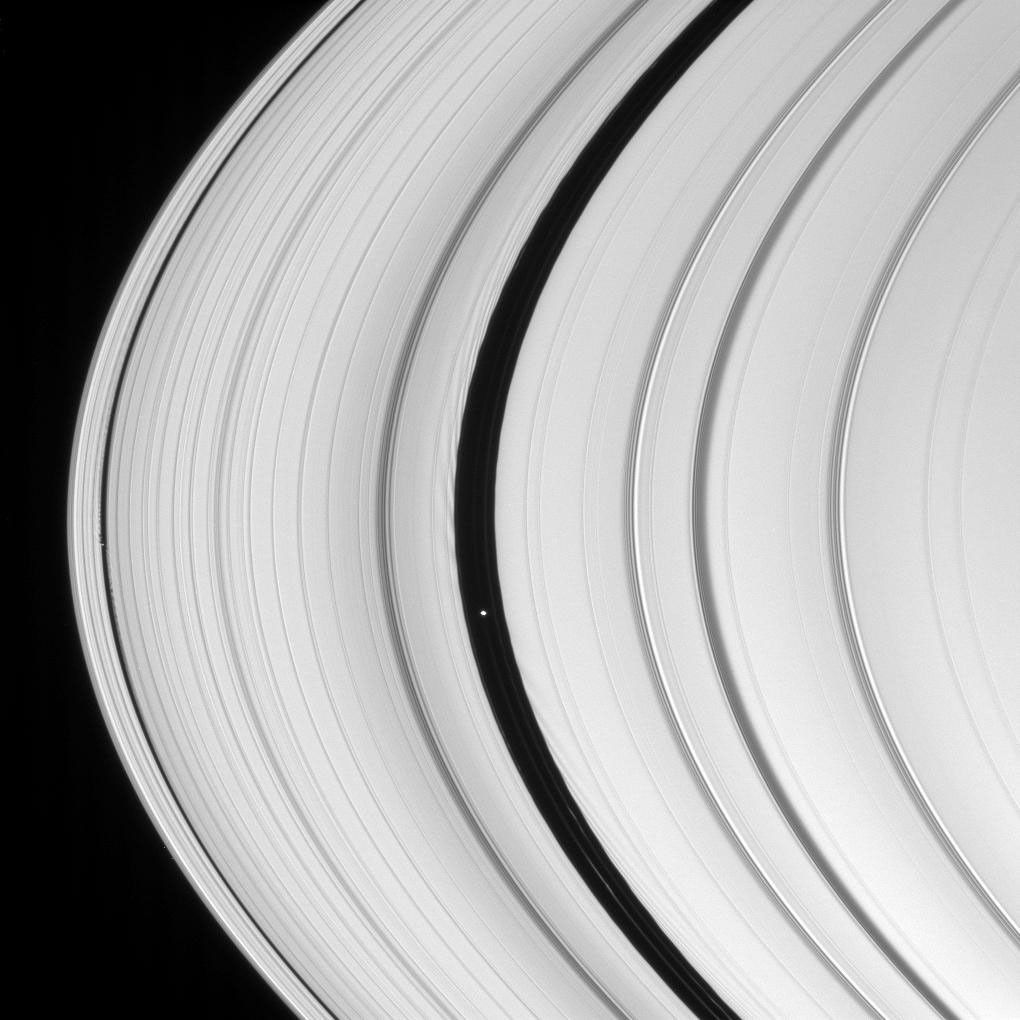 On Dec. 21 1007, NASA's Cassini spacecraft viewed Saturn's two ring-embedded moons, Daphnis and Pan, along with clearly visible signs of their perturbing effects on the ring edges that border the gaps they inhabit.