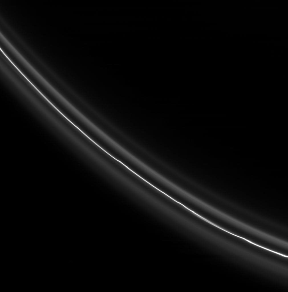 The bright, perturbed core of Saturn's F ring displays several kink-like features. The core is flanked by dimmer, smoother ringlets. This image was captured by NASA's Cassini spacecraft on Dec. 2, 2007.