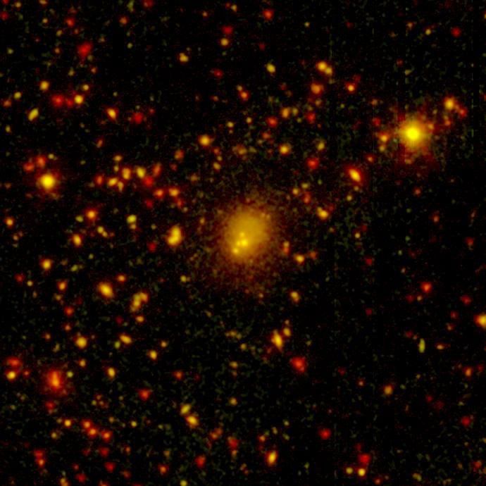 NASA's Spitzer Space Telescope spotted a four-way collision, or merger, in a giant cluster of galaxies, called CL0958+4702, located nearly five billion light-years away.