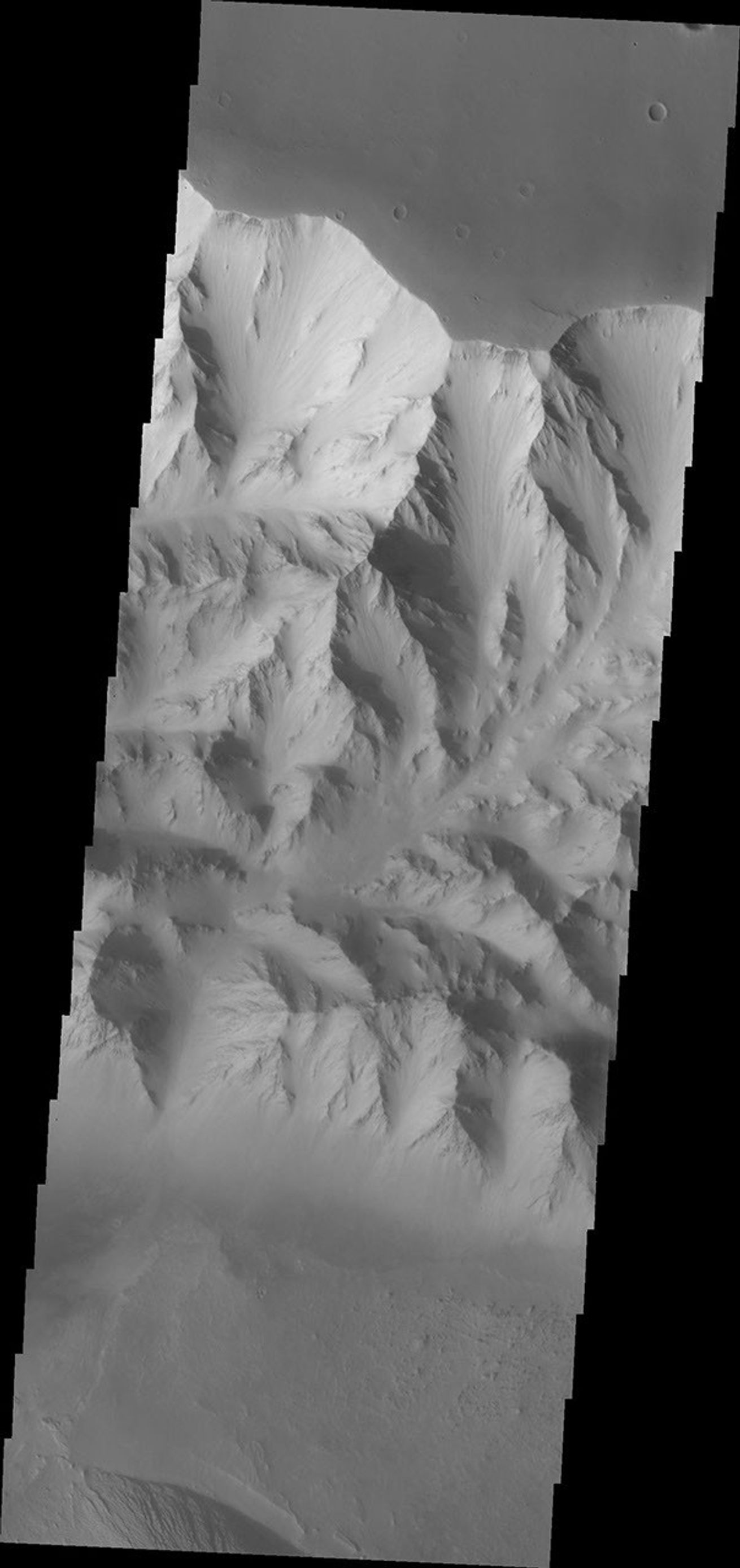 This image from NASA's Mars Odyssey spacecraft shows the rugged northern wall of the canyon Ophir Chasma on Mars.