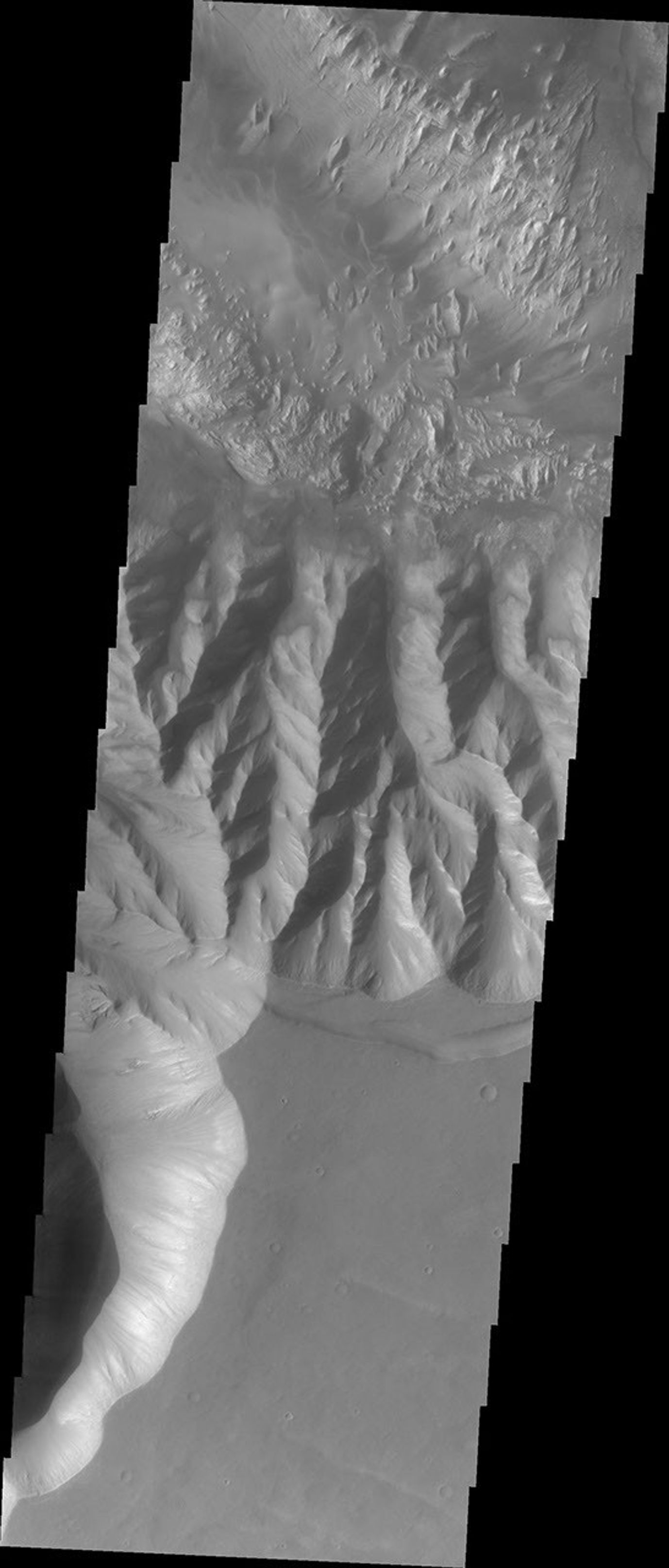 This image from NASA's Mars Odyssey spacecraft shows Hebes Chasma on Mars containing complex layered deposits that have been modified by wind action.