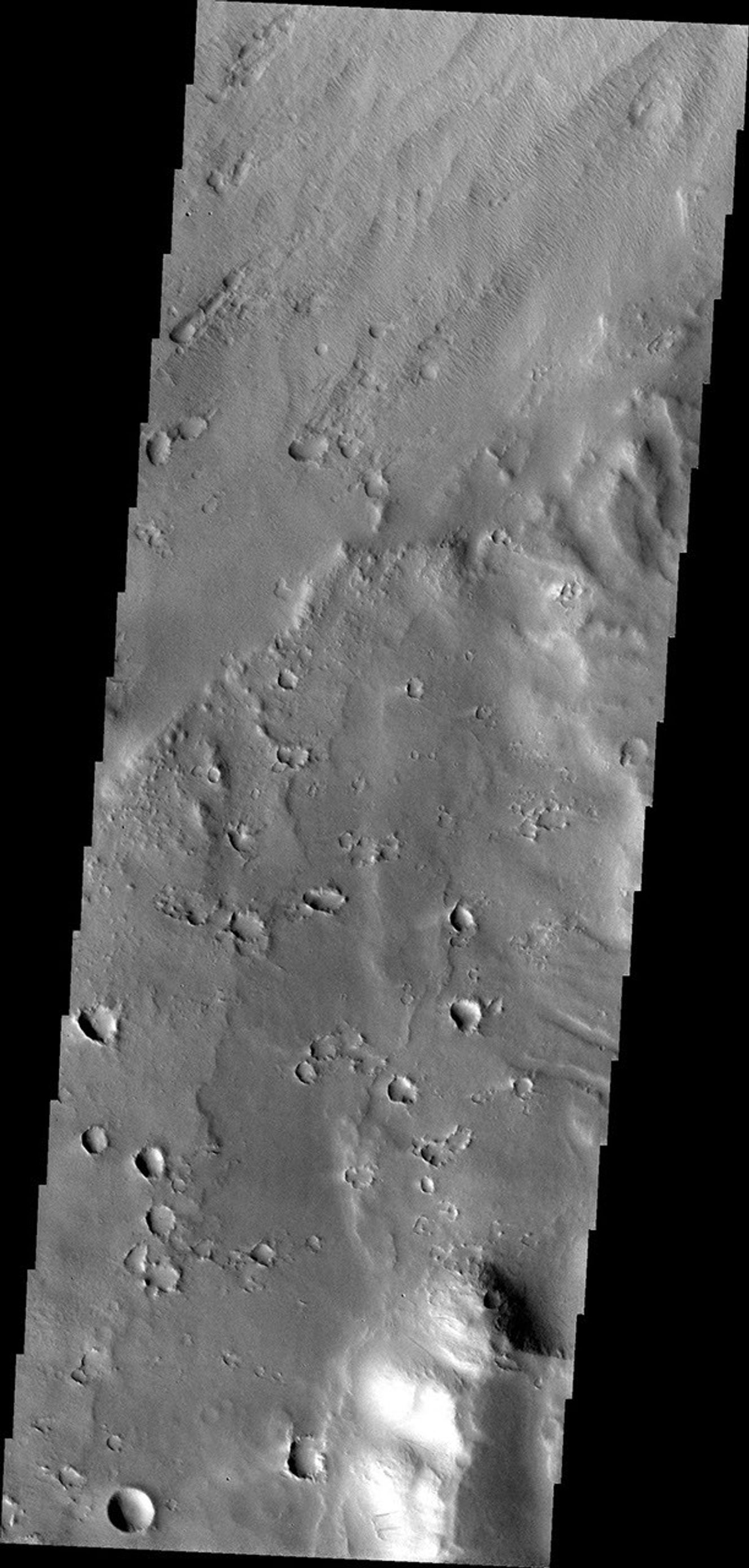 This image from NASA's Mars Odyssey spacecraft shows Apollinaris Patera, an old volcano on Mars that has undergone extensive erosion.