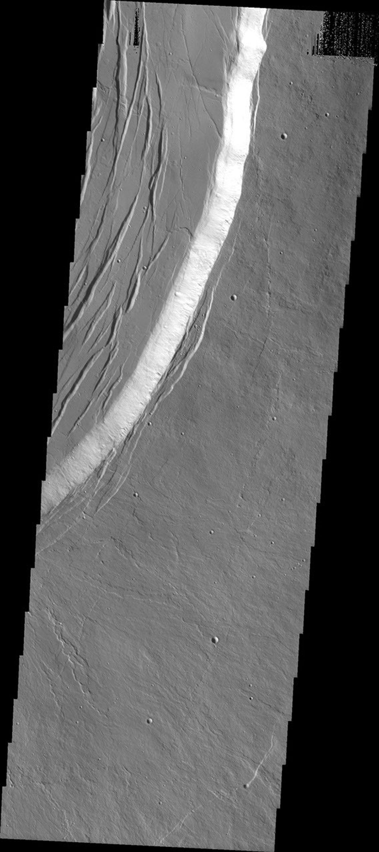 This image from NASA's Mars Odyssey spacecraft shows the summit of Olympus Mons on Mars.