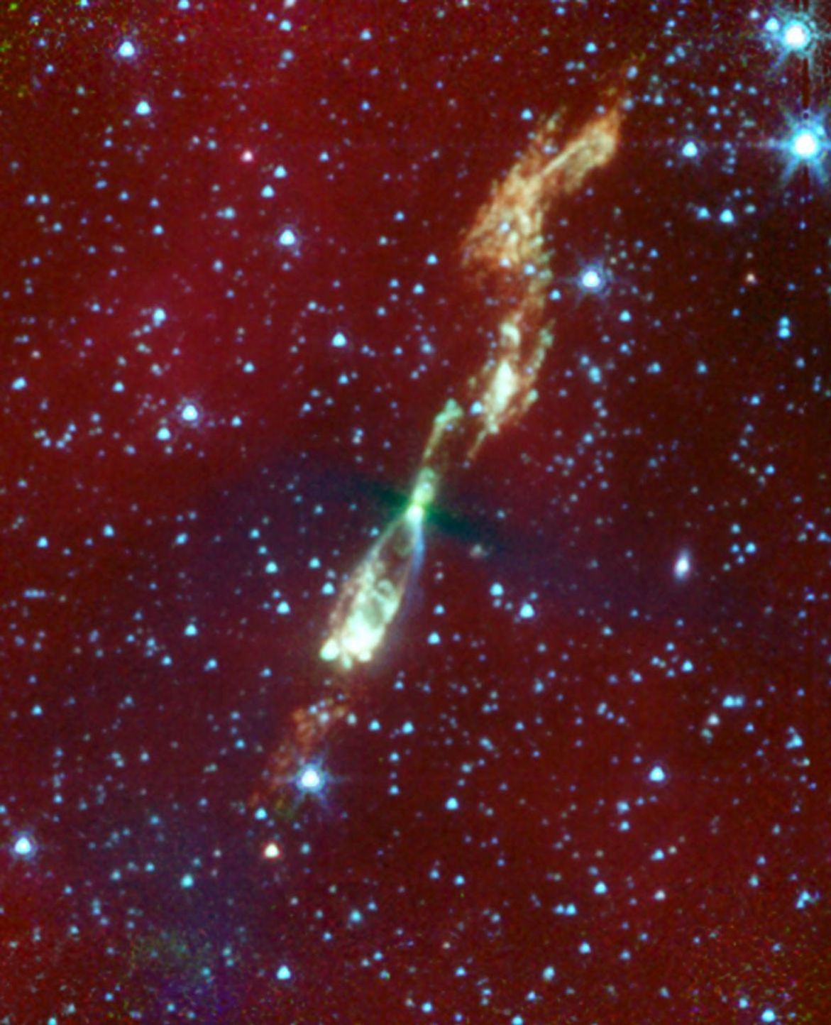 A rare, infrared view of a developing star and its flaring jets taken by NASA's Spitzer Space Telescope shows us what our own solar system might have looked like billions of years ago.