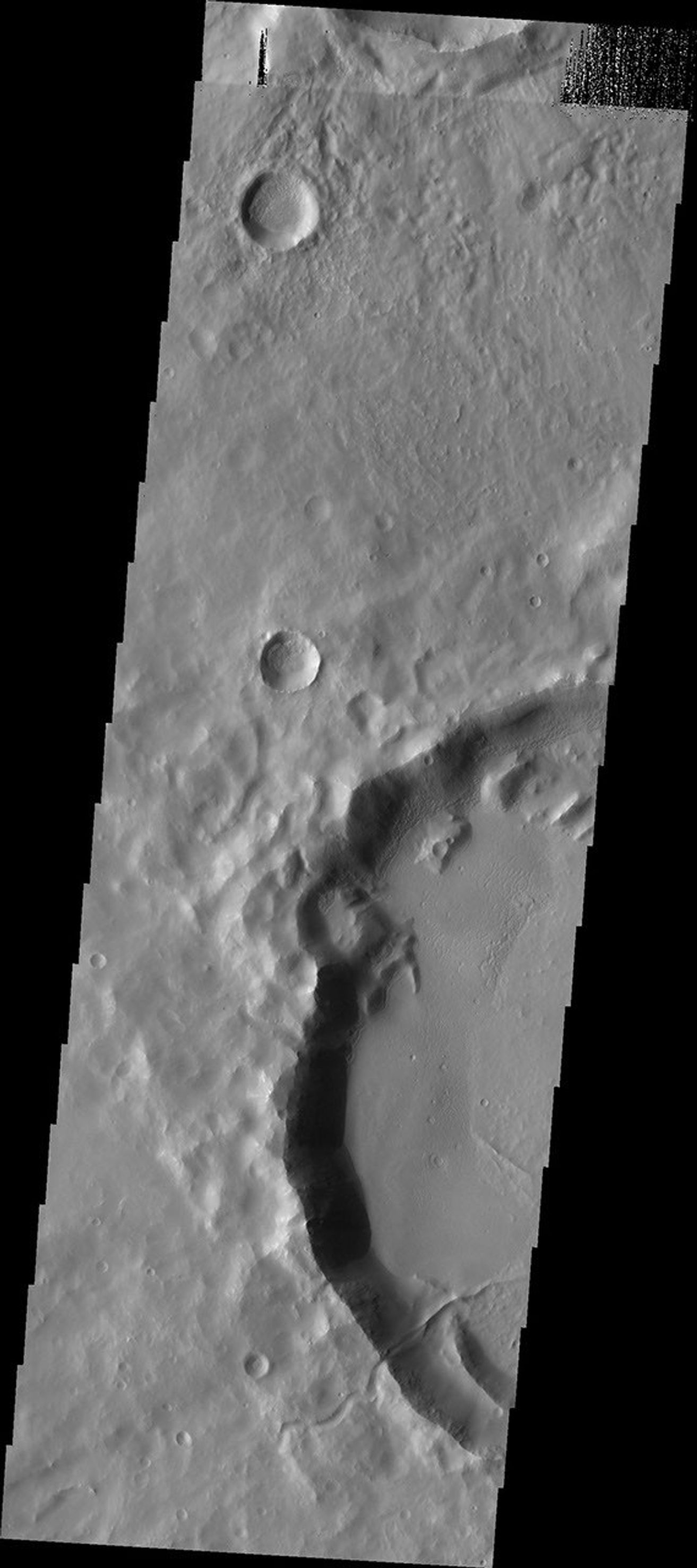 This image from NASA's Mars Odyssey shows a small channel on Mars that enters the crater appearing to become a ridge as it crosses onto the crater floor.
