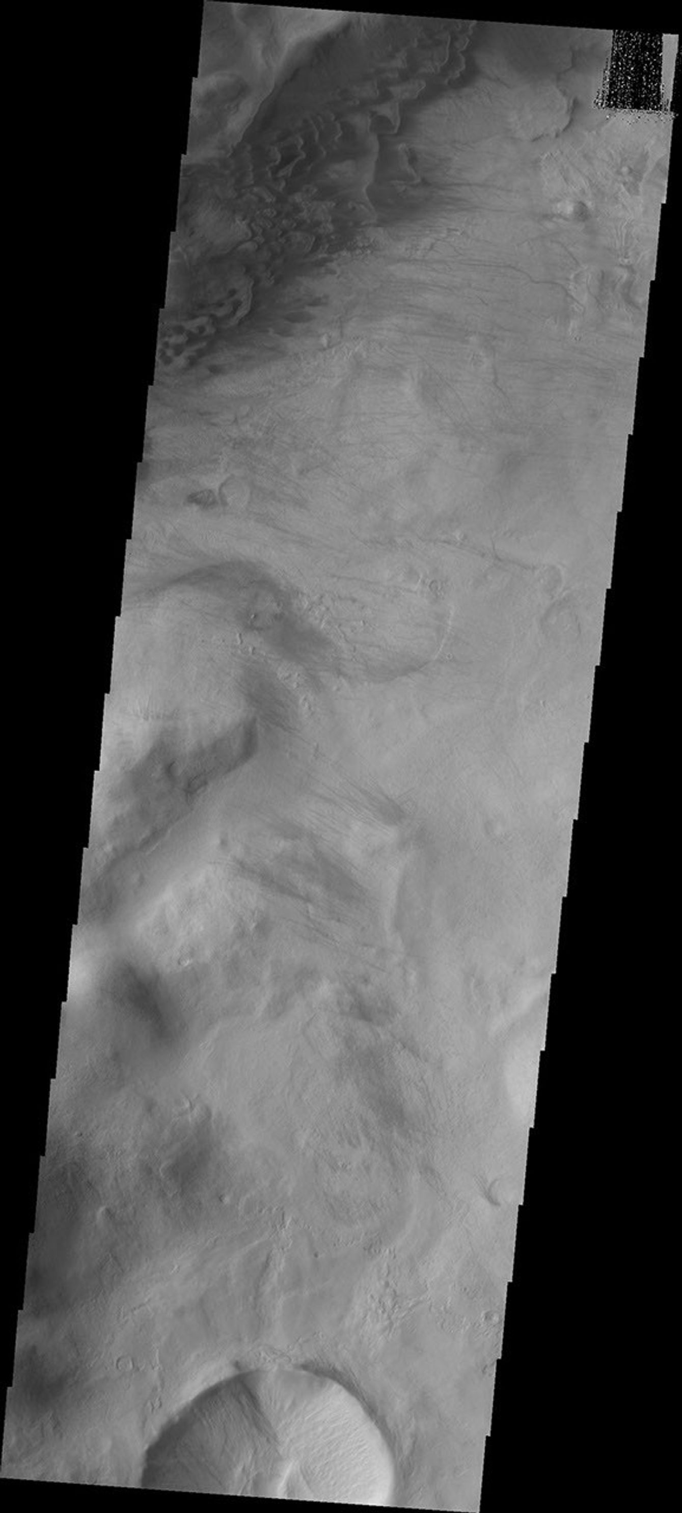This image from NASA's Mars Odyssey shows sand dunes located in the mountains at the margin of the Argyre Basin.