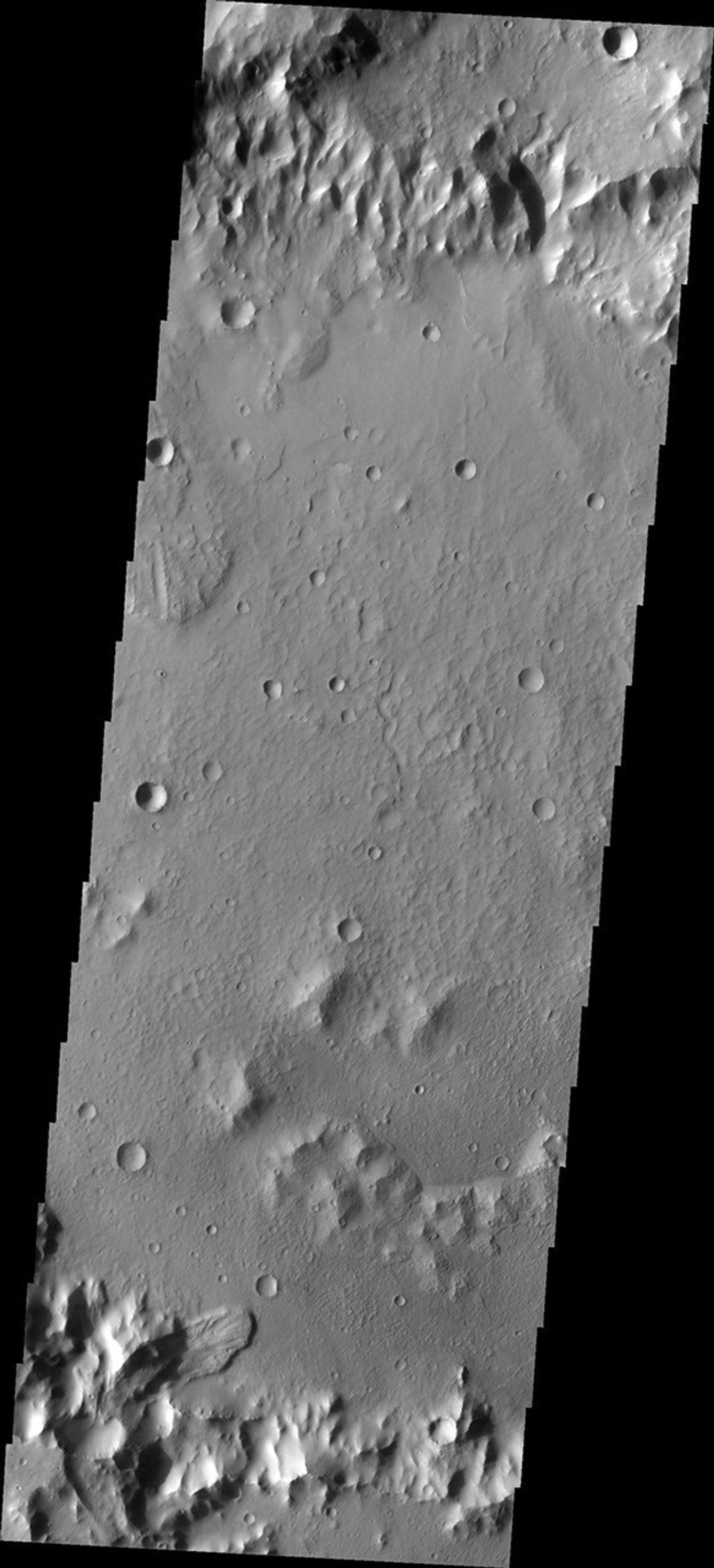 This image from NASA's Mars Odyssey shows a landslide deposit in an unnamed crater in Terra Cimmeria.
