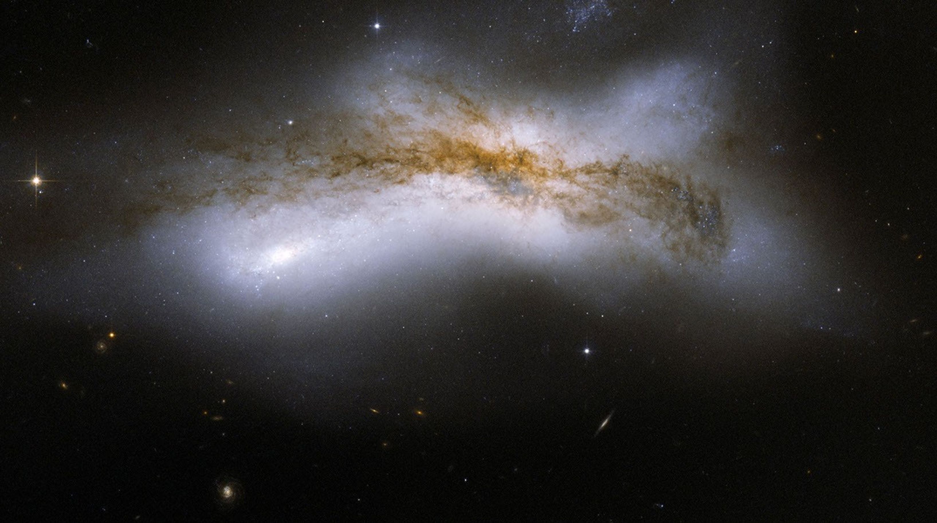 NGC 520 is the product of a collision between two disk galaxies that started 300 million years ago. This image is part of a large collection of images of merging galaxies taken by NASA's Hubble Space Telescope.