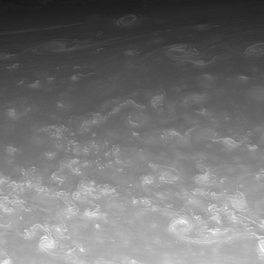 Sinuous clouds and hurricane-sized vortices mingle in Saturn's northern skies. This image was acquired with NASA's Cassini spacecraft's narrow-angle camera on May 23, 2008.