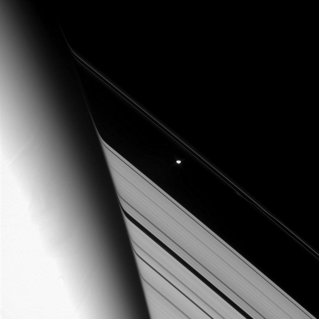 NASA's Cassini spacecraft tracks the shepherd moon Prometheus as it orbits Saturn in this image was captured on Aug. 9, 2008.