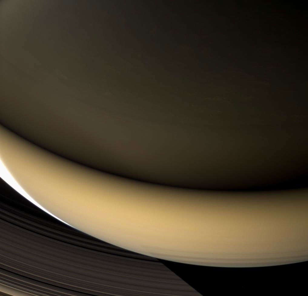 Large regions of Saturn's night side are illuminated by the planet's gleaming rings. Except for a sliver of the sunlit crescent at left, this view from NASA's Cassini spacecraft shows a part of the planet lit almost entirely by ringshine.