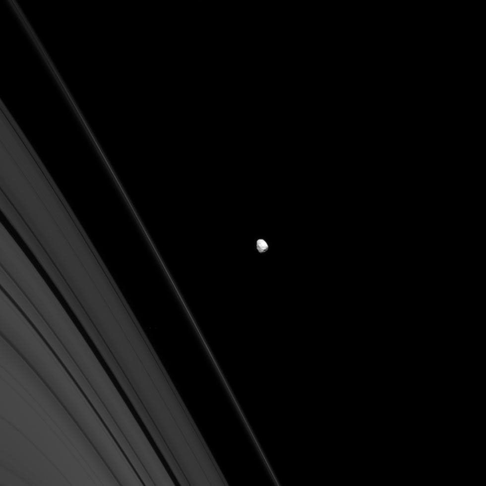 Saturn's battered moon Janus wears the record of its long history of impacts. Janus orbits just beyond the outer reaches of Saturn's A and F rings in this image captured by NASA's Cassini spacecraft on Sept. 28, 2008.