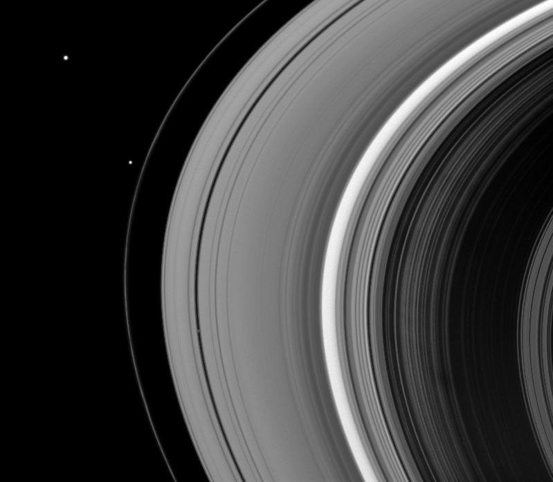 Three of Saturn's satellites, Janus, Pandora (just outside the F ring), and Pan are visible in this snapshot from NASA's Cassini spacecraft taken on Dec. 7, 2008.