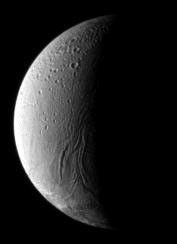 In the boundary between light and shadow on Saturn's moon Enceladus, run the Anbar Fossae— a series of narrow, shallow depressions. This image was taken by NASA's Cassini spacecraft's narrow-angle camera on Dec. 17, 2008.
