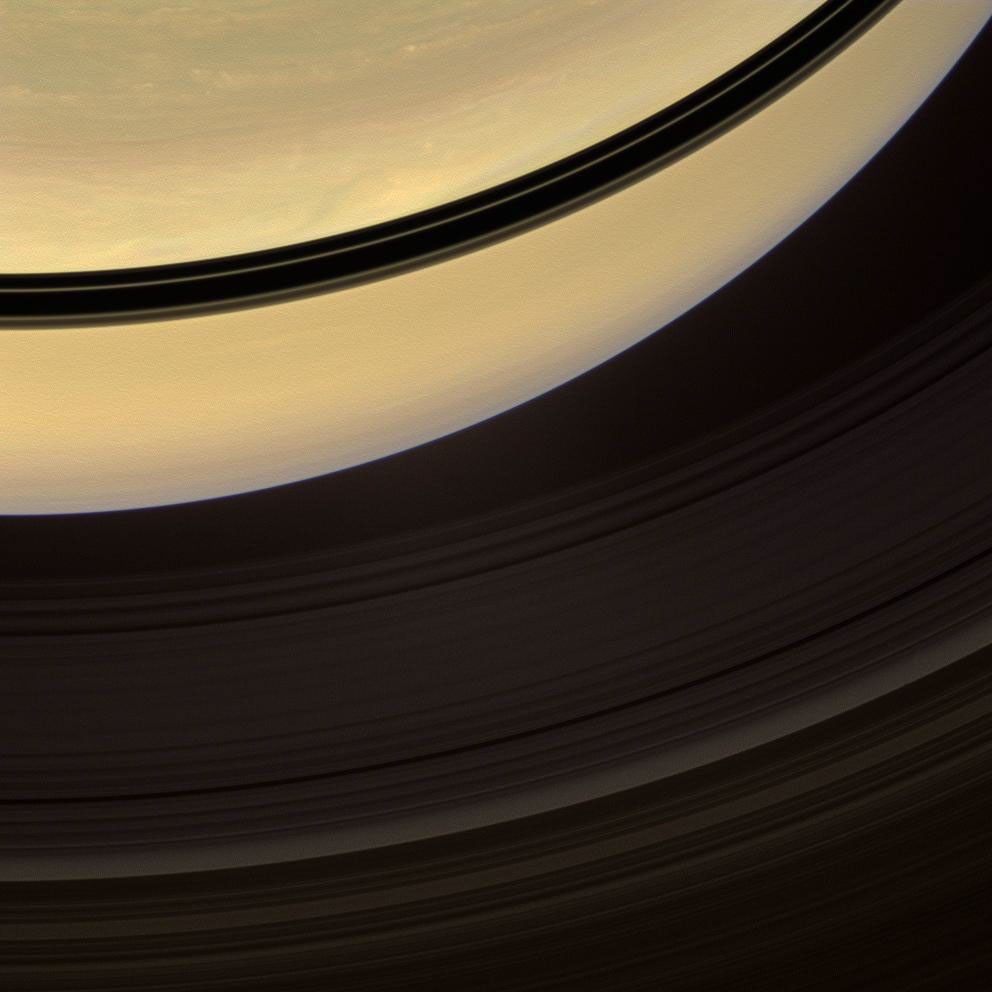Shadows cast onto Saturn by its rings, visible here as dark bands, move steadily towards the equator and grow thinner as equinox approached on on Nov. 22, 2008. This image is from NASA's Cassini spacecraft.