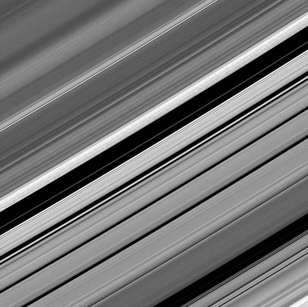 Dark straw-like patterns dot Saturn's bright outer B ring just left of the Huygens Gap in the center of this image taken by NASA's Cassini spacecraft on Dec. 8, 2008.