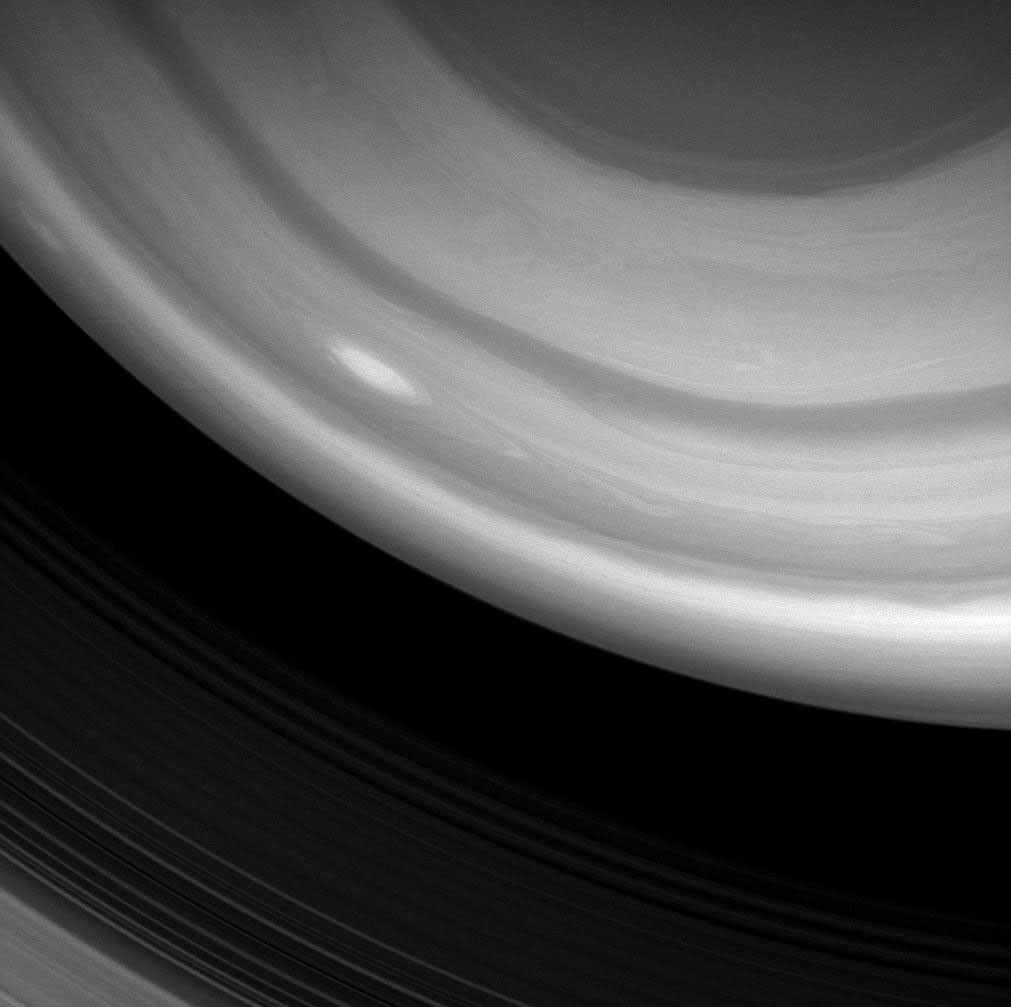 NASA's Cassini spacecraft image captured a bright, oblong storm swirling high through the middle latitudes of the southern hemisphere. taken on Jan. 5, 2008.