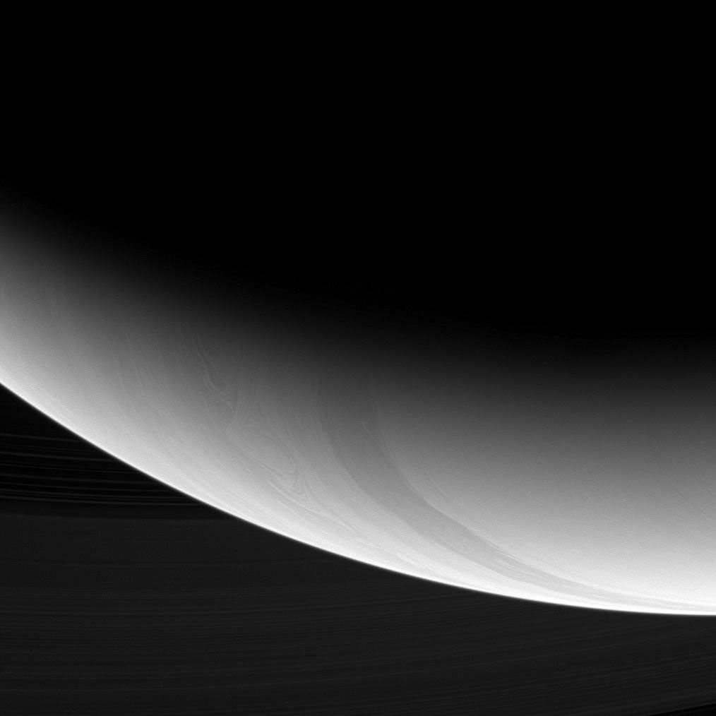 Intricate curlicues and circular patterns of storms swirl through the high latitudes near Saturn's south pole in this image from NASA's Cassini spacecraft.
