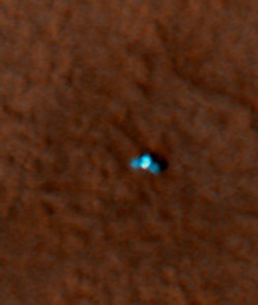 This is an enhanced-color image from Mars Reconnaissance Orbiter's High Resolution Imaging Science Experiment (HiRISE) camera. It shows the NASA's Mars Phoenix lander with its solar panels deployed on the Mars surface