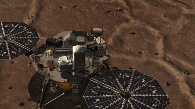 This image of a camera going through the Surface Stereo Imager (SSI) on NASA's Phoenix lander. At the end of the animation is an approximate color mosaic taken by Phoenix's SSI camera.