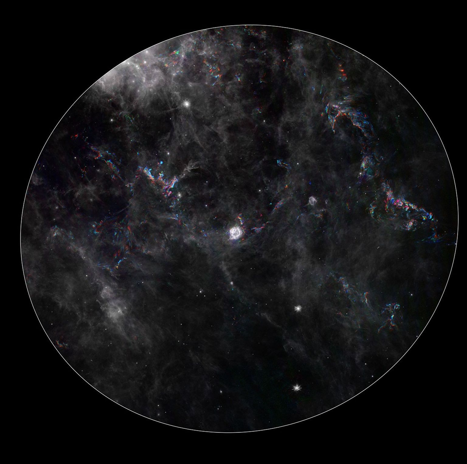 This composite image from NASA's Spitzer Space Telescope shows the remnant of a star that exploded, called Cassiopeia A (center) and its surrounding 'light echoes' -- dances of light through dusty clouds, created when stars blast apart.