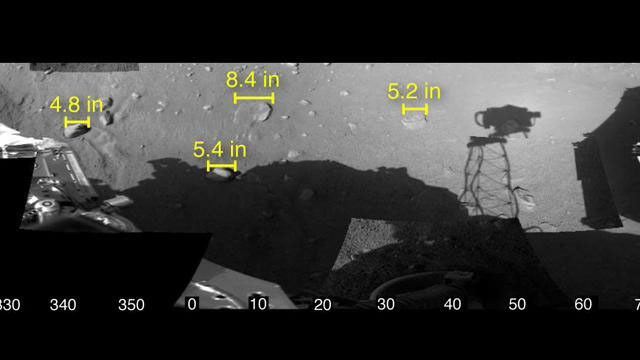 This image shows the workspace reachable by the scoop on the robotic arm of NASA's Phoenix Mars Lander, along with some measurements of rock sizes.