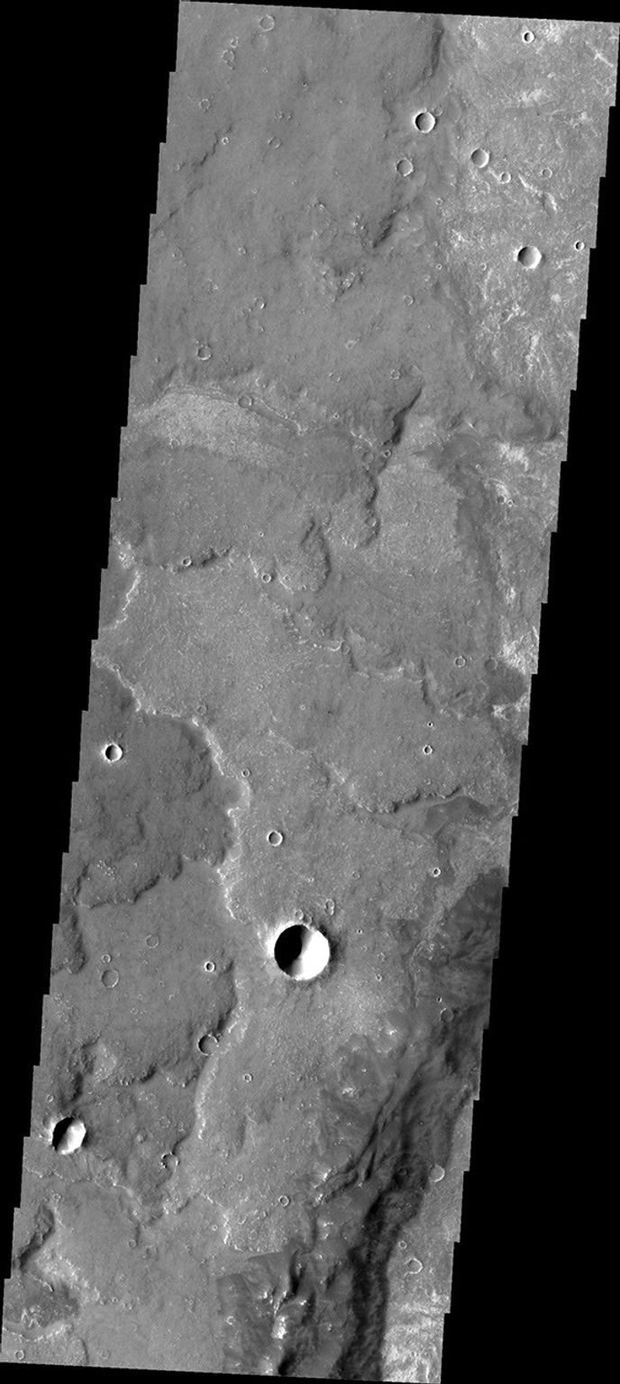 This image from NASA's Mars Odyssey shows some of the extensive lava flows that make up Syria Planum on Mars.
