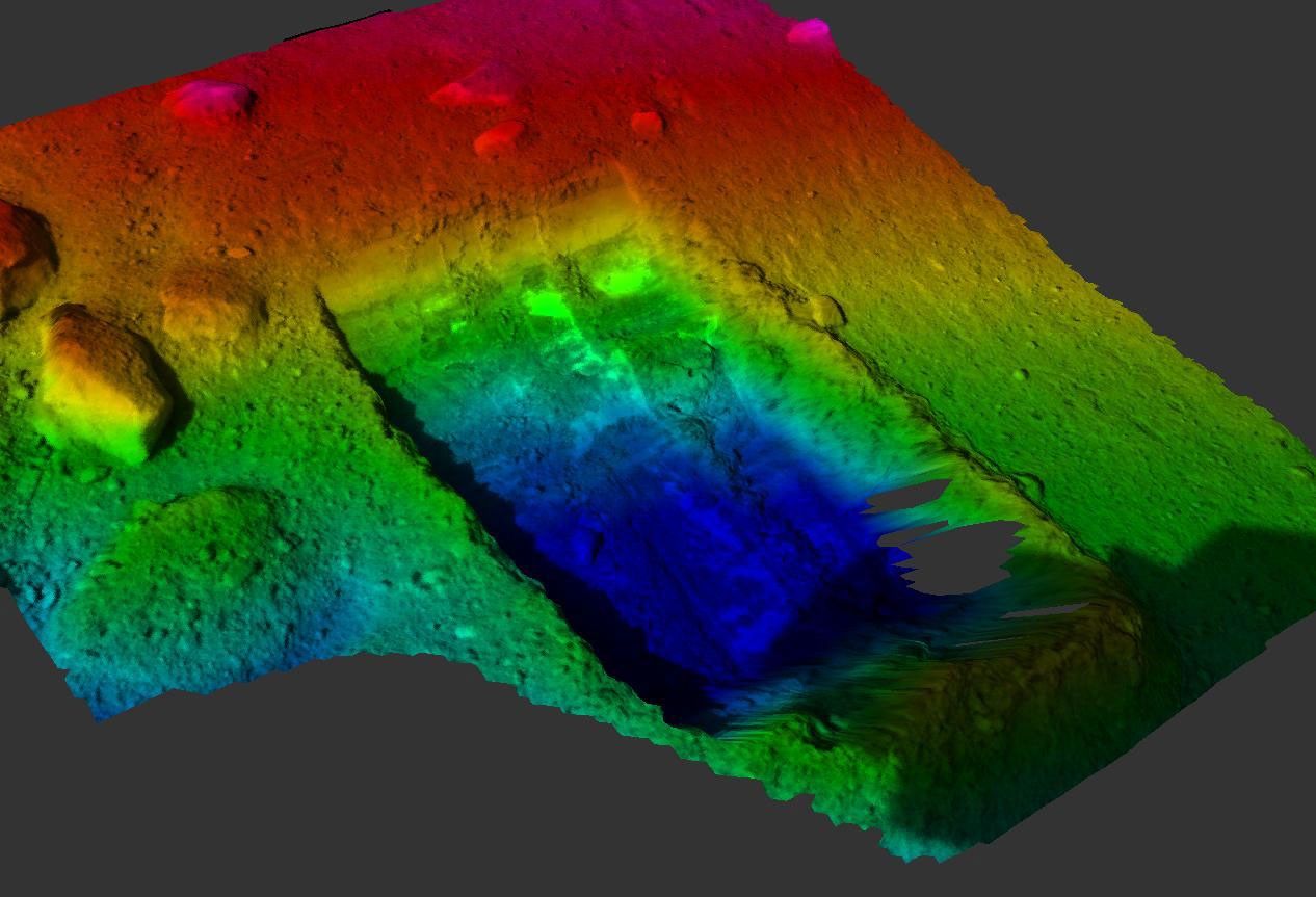 This color-coded elevation map shows the 'Dodo-Goldilocks' trench dug by the Robotic Arm on NASA's Phoenix Mars Lander.