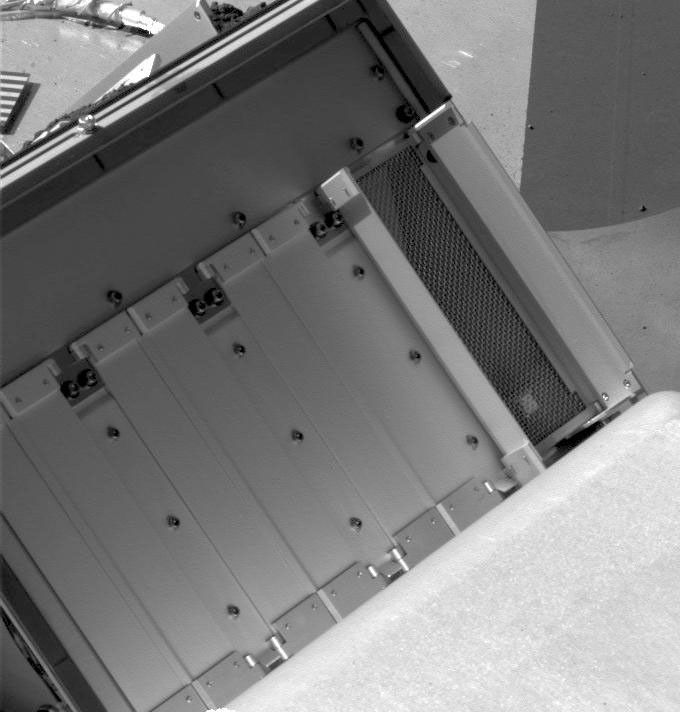 This image taken on July 18, 2008 from NASA's Phoenix Mars Lander shows double doors on the right are wide open on four pairs of oven doors on Phoenix's Thermal and Evolved-Gas Analyzer (TEGA).