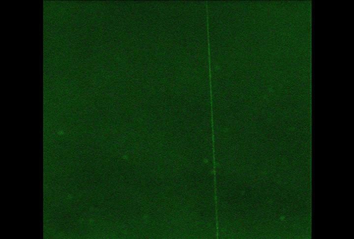 A laser beam from the Canadian-built lidar instrument on NASA's Phoenix Mars Lander can be seen in this contrast-enhanced image taken by Phoenix's Surface Stereo Imager on July 26, 2008, during early Martian morning hours of the 61st Martian day.
