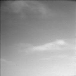 Clouds scoot across the Martian sky in a frame from a movie clip consisting of 10 frames taken by the Surface Stereo Imager on NASA's Phoenix Mars Lander.