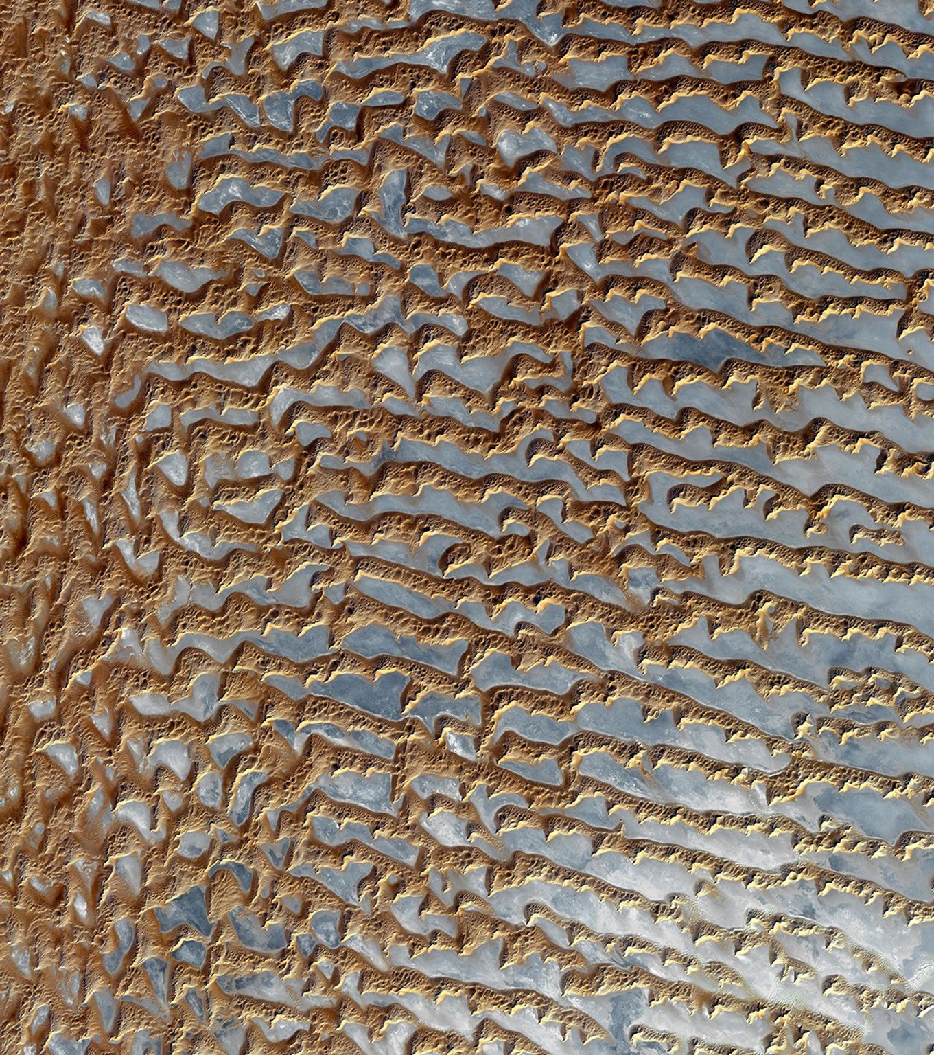NASA's Terra spacecraft shows the Rub' al Khali, one of the largest sand deserts in the world, encompassing most of the southern third of the Arabian Peninsula; it includes parts of Oman, United Arab Emirates, and Yemen.