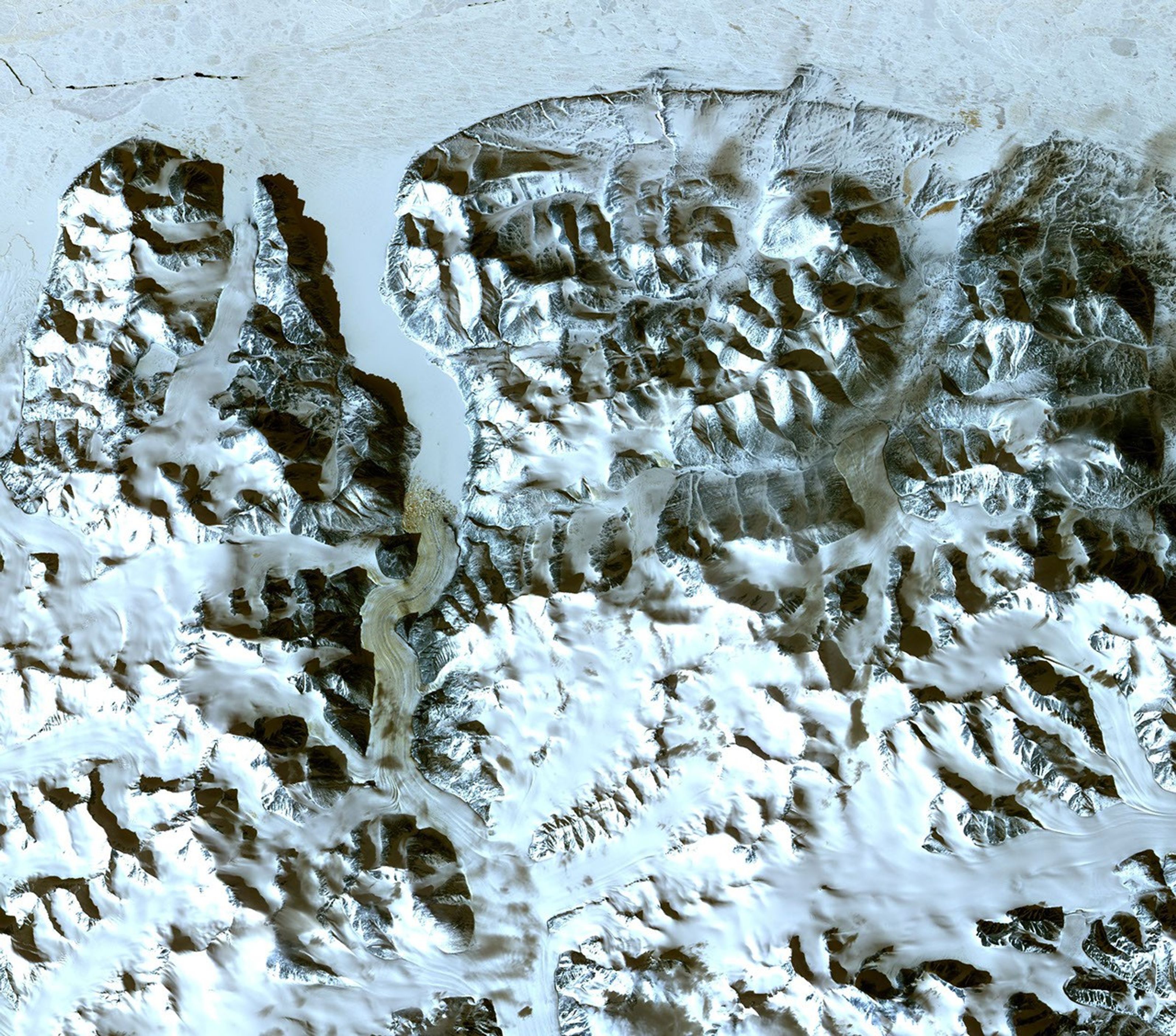 This image acquired by NASA's Terra spacecraft is of the northernmost land in the world is located in Pearyland, Greenland. This is a land of permanent snows, glaciers, and 24-hours of daylight during the summer months.